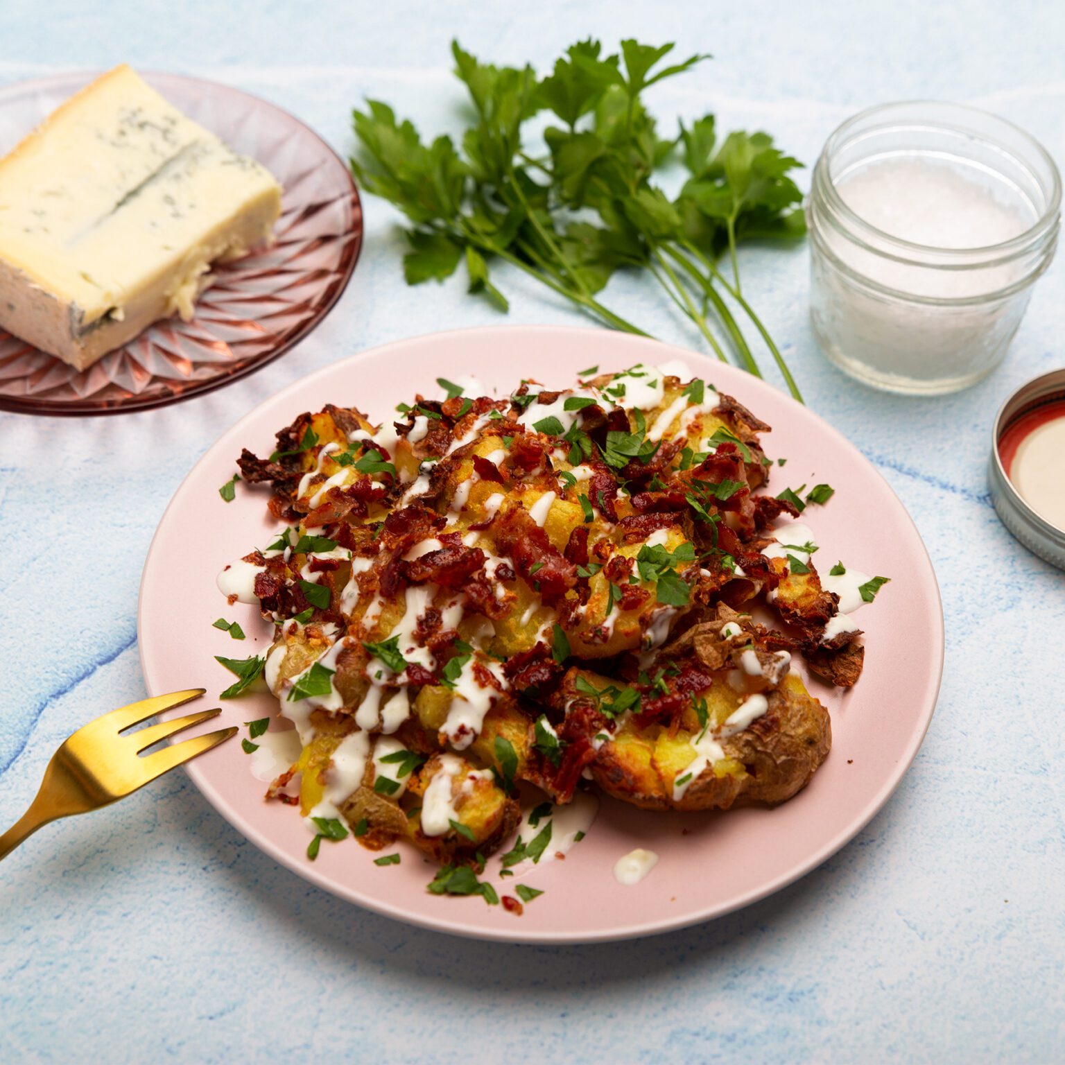 Loaded Smashed Potatoes with bacon & Blue Cheese Sauce